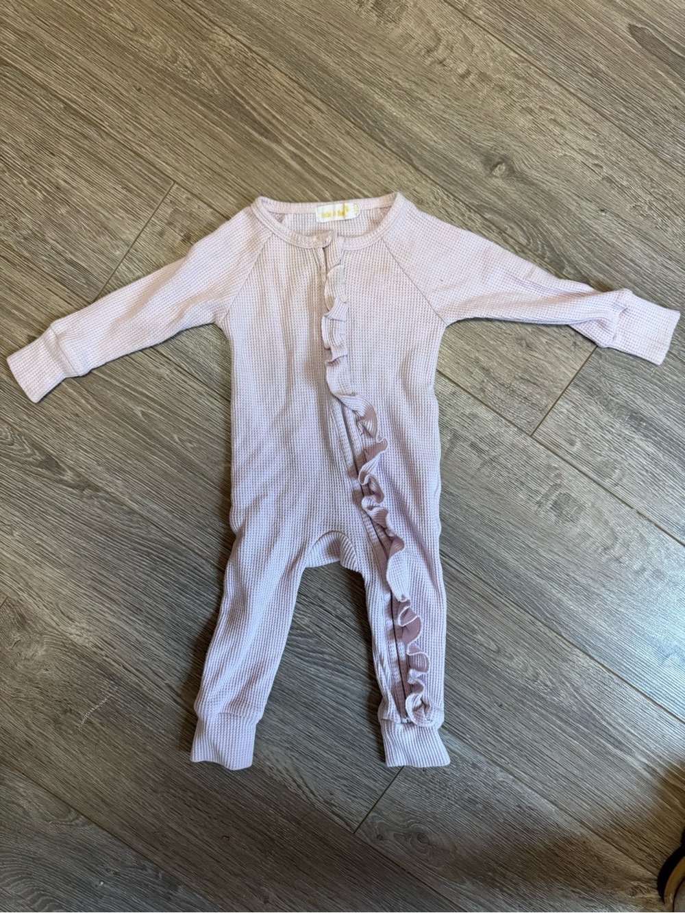 Soft Ruffle-Front Long Sleeve One-Piece Bodysuit in Light Pink